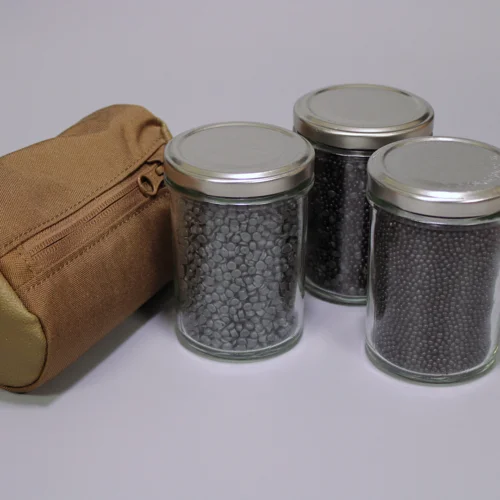 Jars of LiteFill, HeviFill and MixFill shooting bag fills, with a shooting bag.